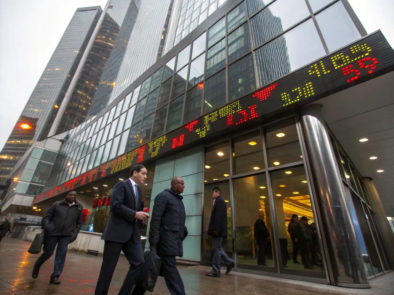 A professional image of a modern office building representing the Financial Services industry, with subtle digital overlays to signify technology integration.